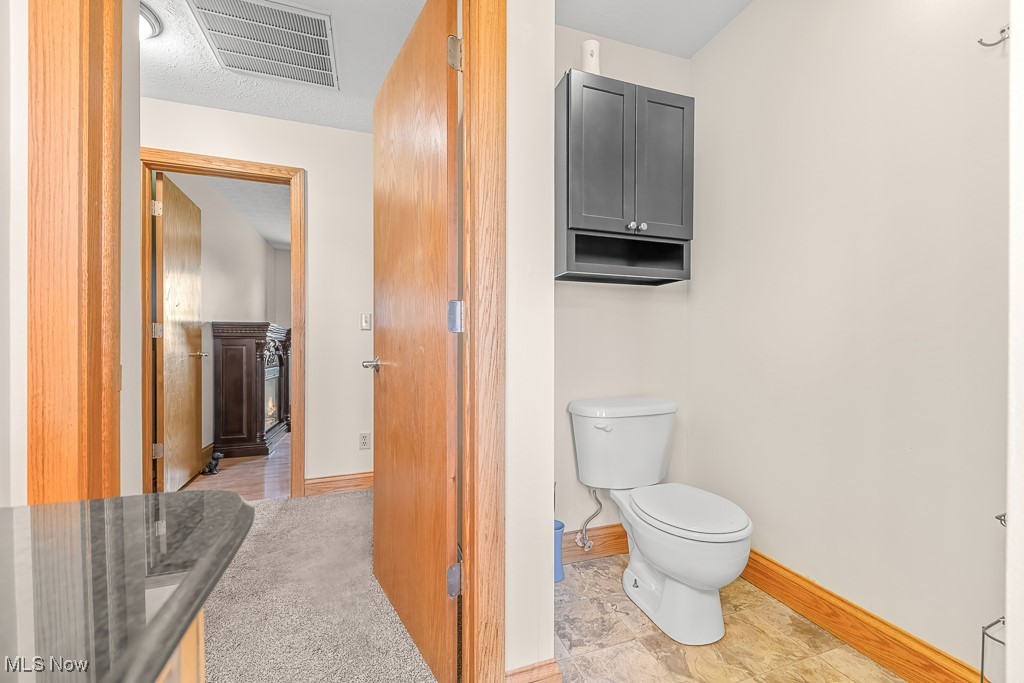 8690 Friendsville Road Lodi, OH 44254 - Photo 35 of 50 Bathroom with toilet, visible vents, and baseboards