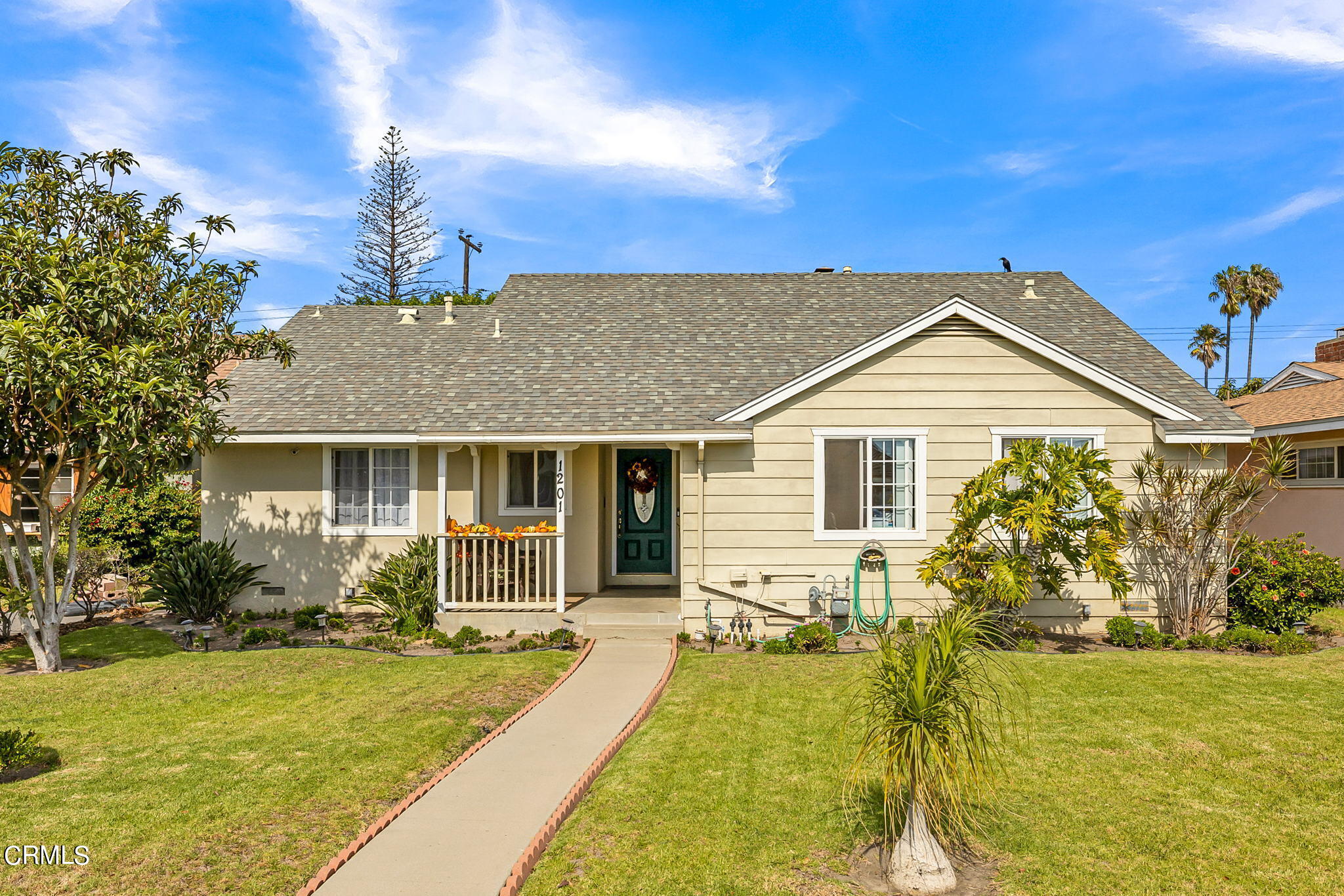 1201 West Roderick Avenue Oxnard, CA 93030 - Photo 1 of 32 a front view of a house with a yard