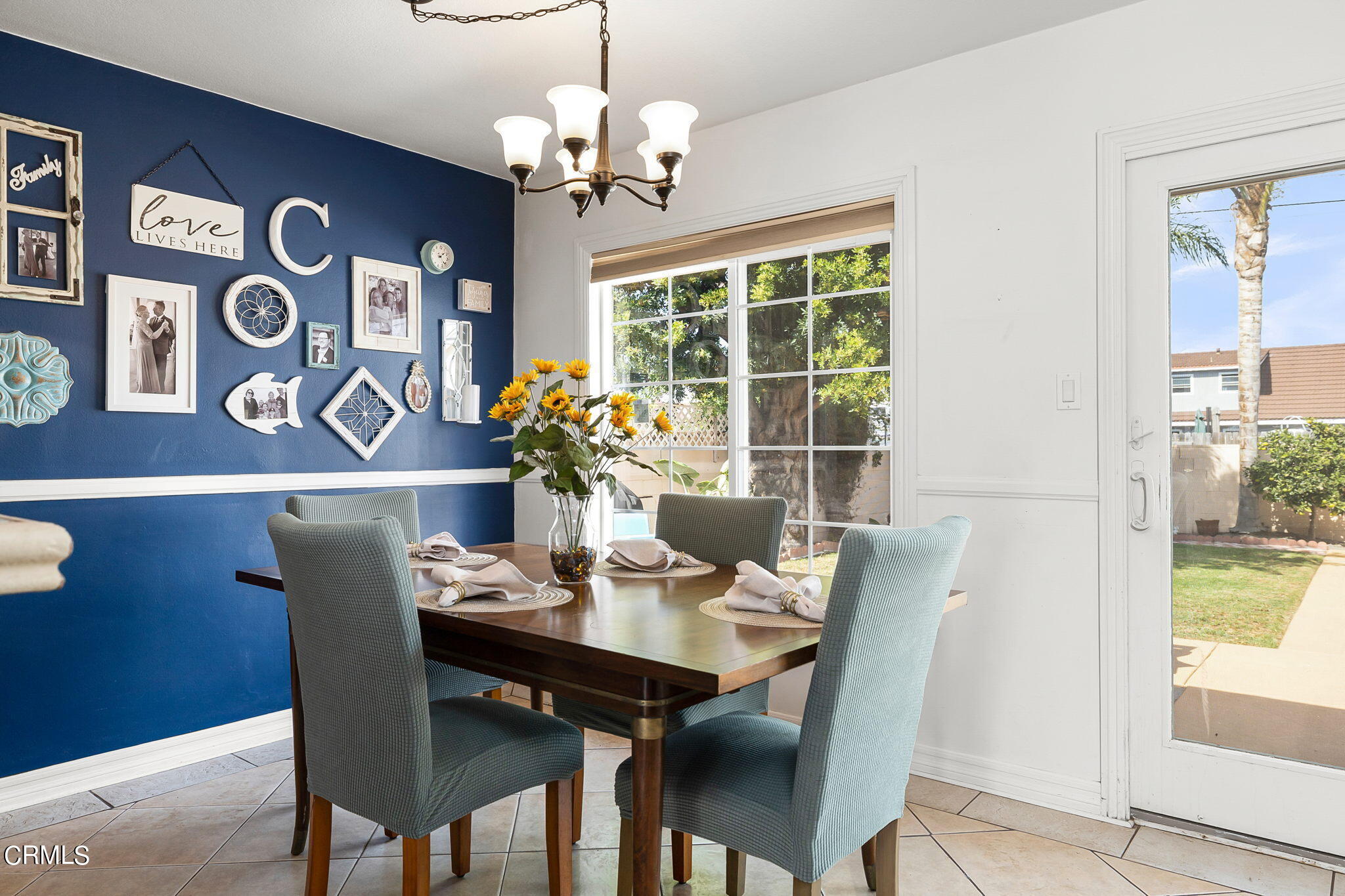 1201 West Roderick Avenue Oxnard, CA 93030 - Photo 11 of 32 a view of a dining room with furniture window and wooden floor