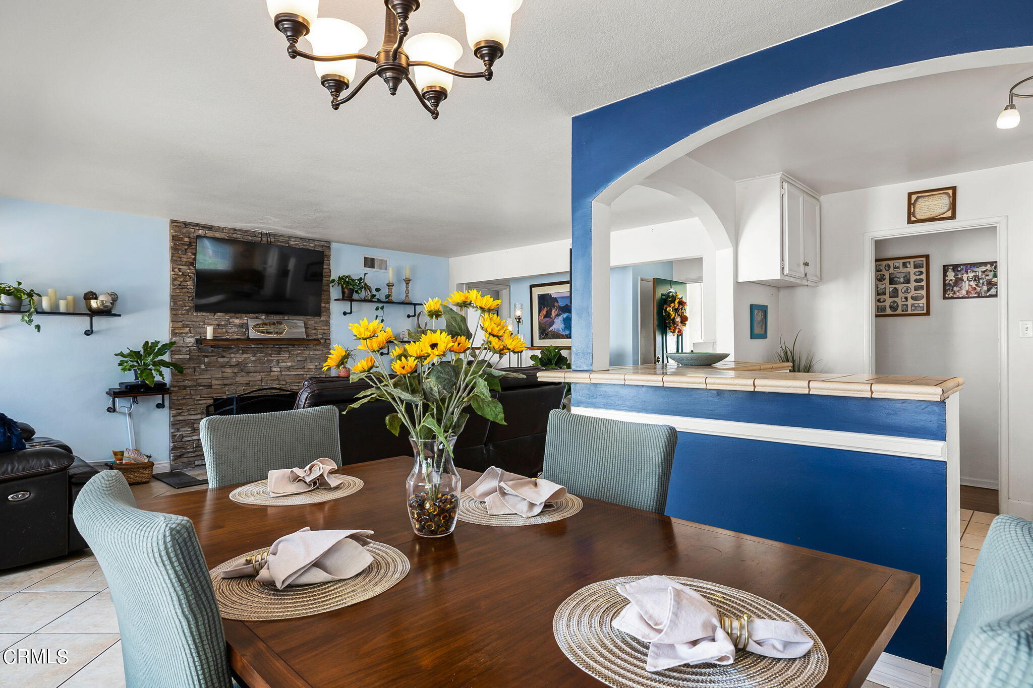 1201 West Roderick Avenue Oxnard, CA 93030 - Photo 12 of 32 a dining room with furniture a rug and wooden floor