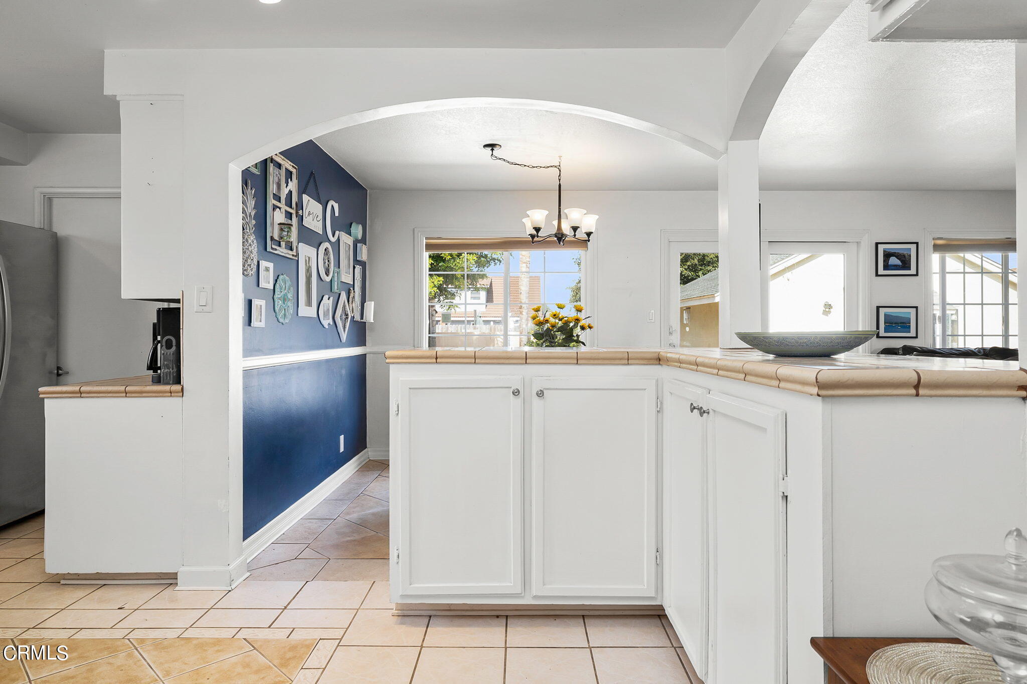 1201 West Roderick Avenue Oxnard, CA 93030 - Photo 16 of 32 a kitchen with white cabinets and sink
