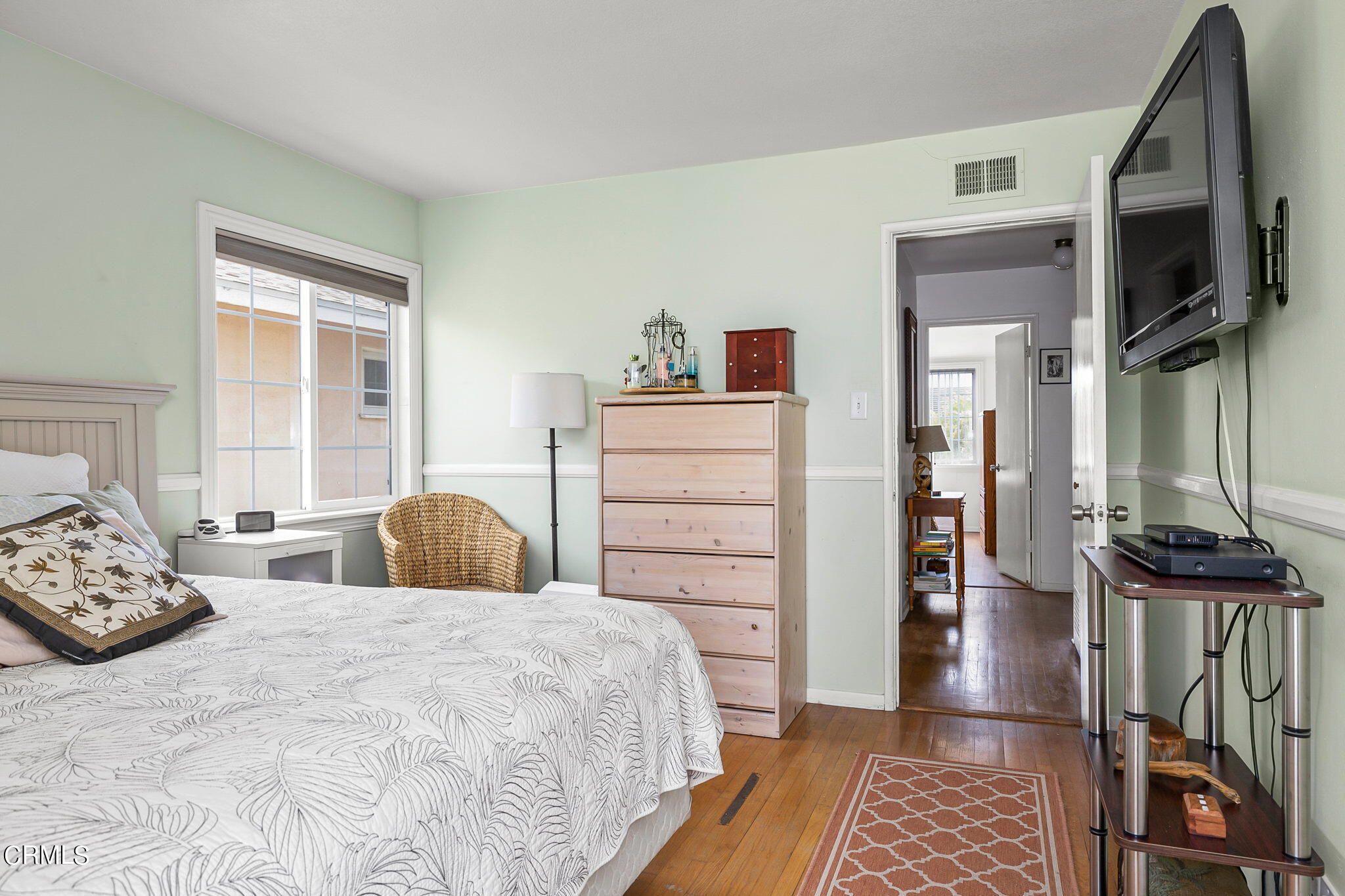 1201 West Roderick Avenue Oxnard, CA 93030 - Photo 17 of 32 a bedroom with a bed a flat screen tv and dresser