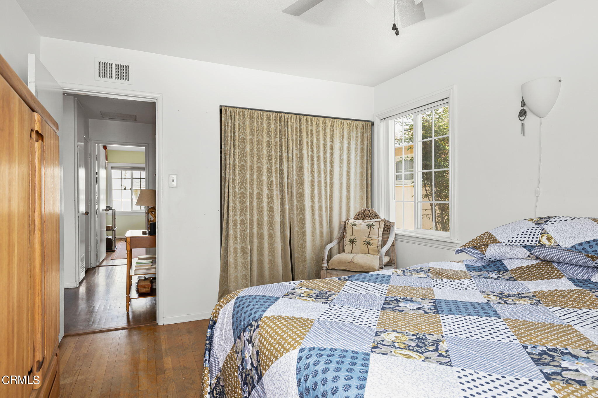 1201 West Roderick Avenue Oxnard, CA 93030 - Photo 21 of 32 a bedroom with a bed and wooden floor