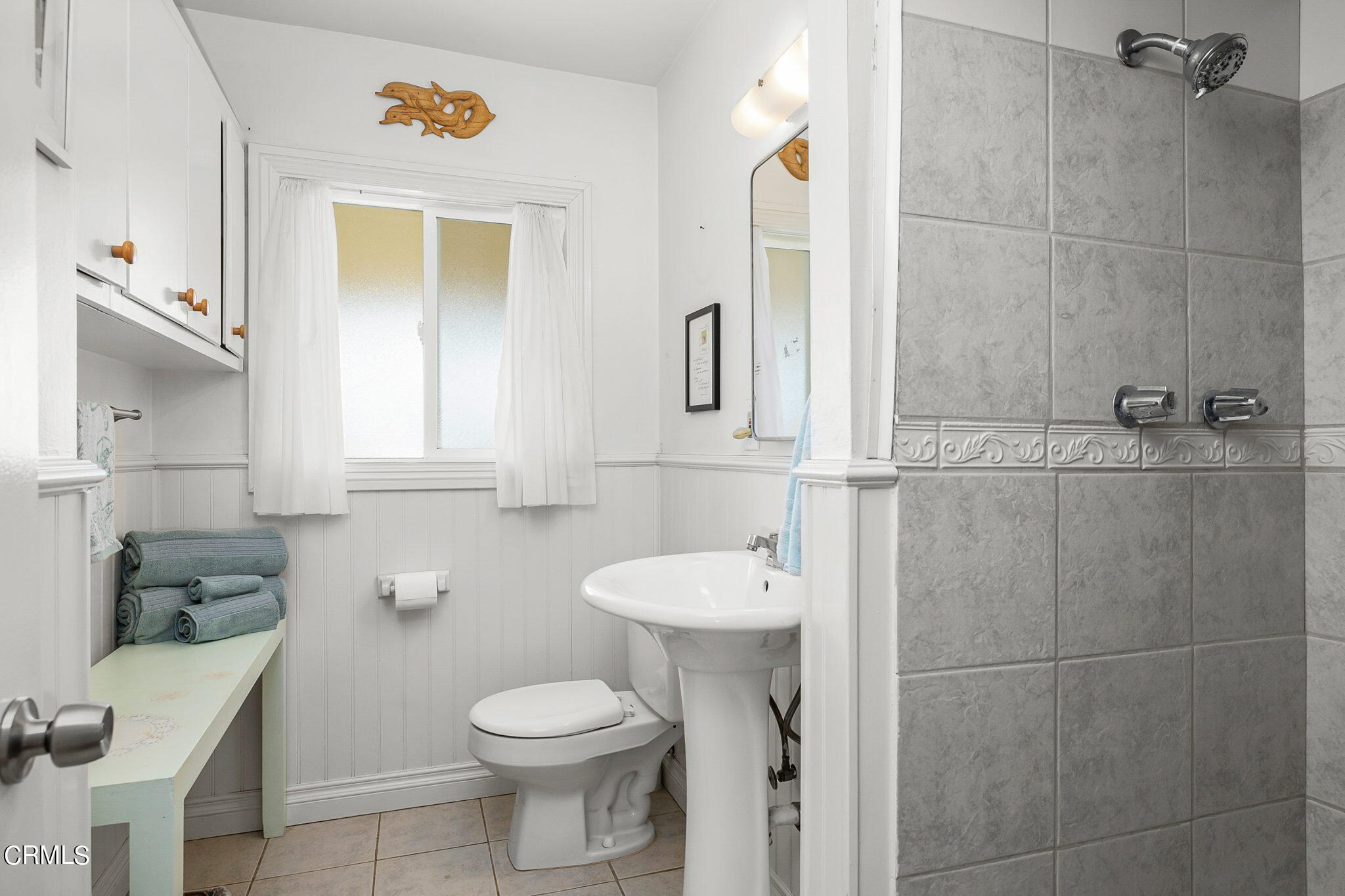 1201 West Roderick Avenue Oxnard, CA 93030 - Photo 22 of 32 a bathroom with a toilet a sink and mirror