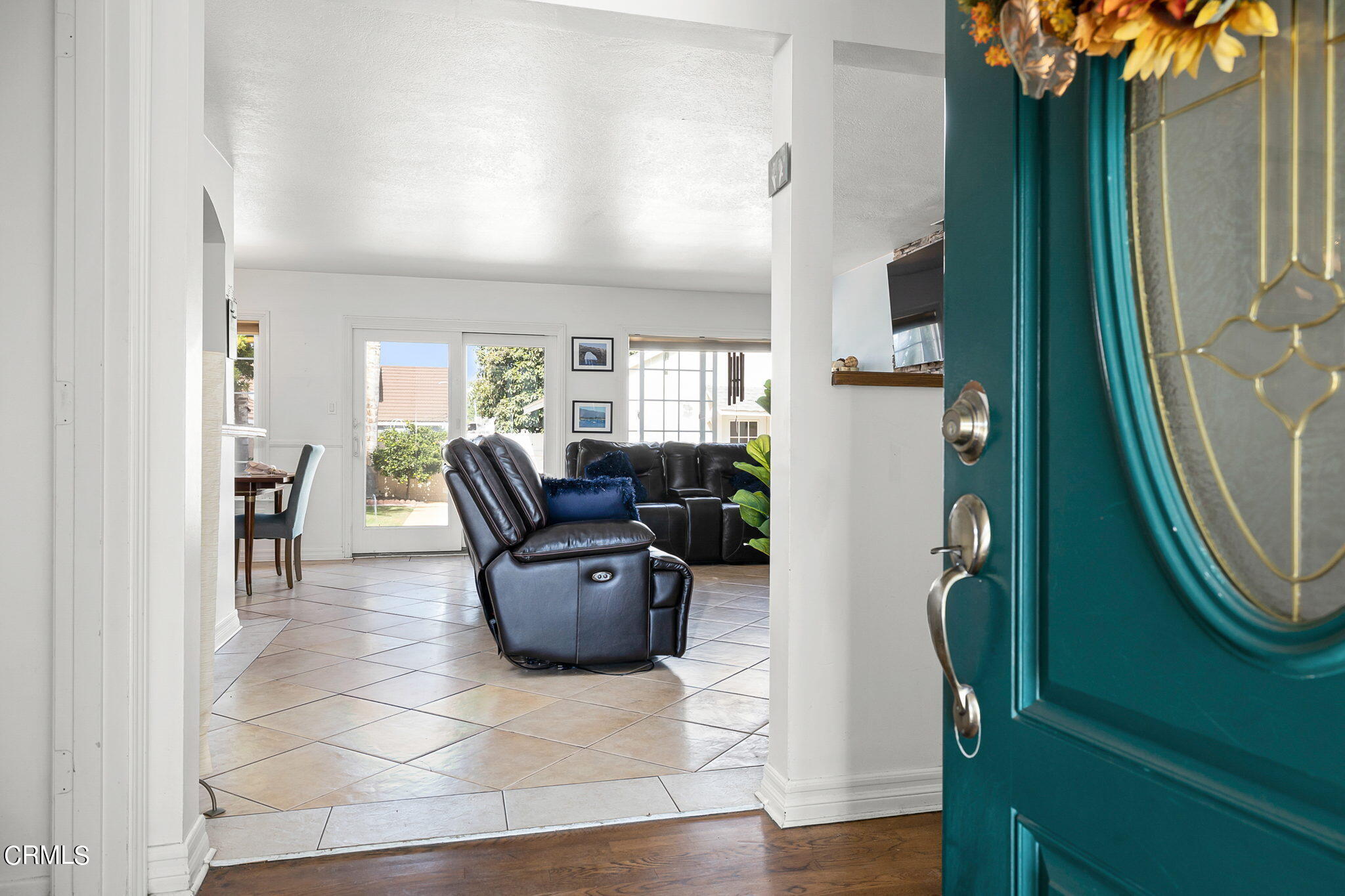 1201 West Roderick Avenue Oxnard, CA 93030 - Photo 5 of 32 a living room with furniture and a mirror