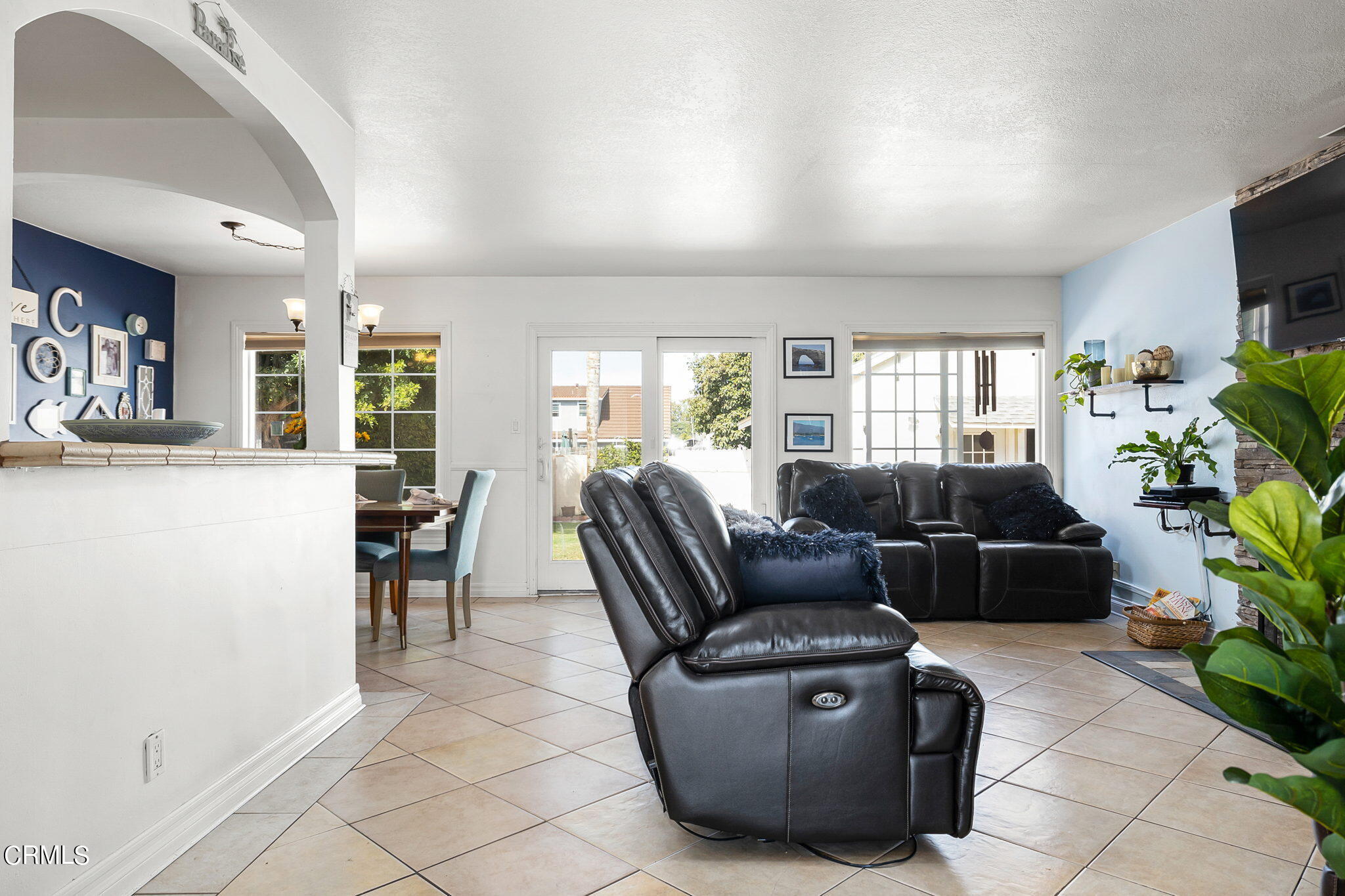 1201 West Roderick Avenue Oxnard, CA 93030 - Photo 6 of 32 a living room with furniture and a flat screen tv