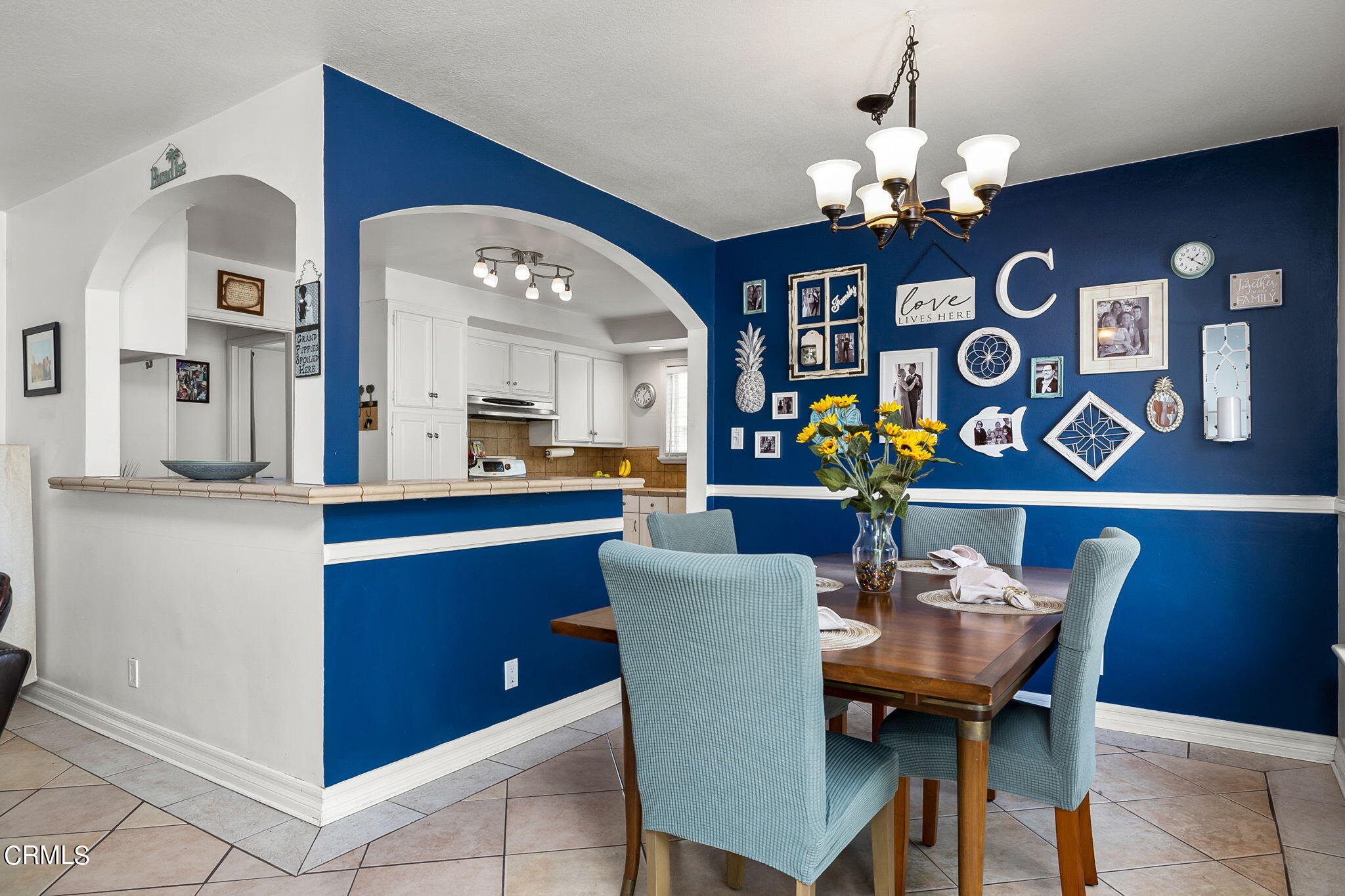 1201 West Roderick Avenue Oxnard, CA 93030 - Photo 10 of 32 a view of a dining room with furniture and chandelier