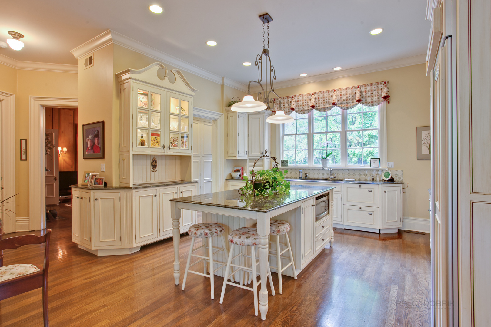 644 East Deerpath Road Lake Forest, IL 60045 - Photo 20 of 48 a kitchen with stainless steel appliances a dining table chairs and wooden floor