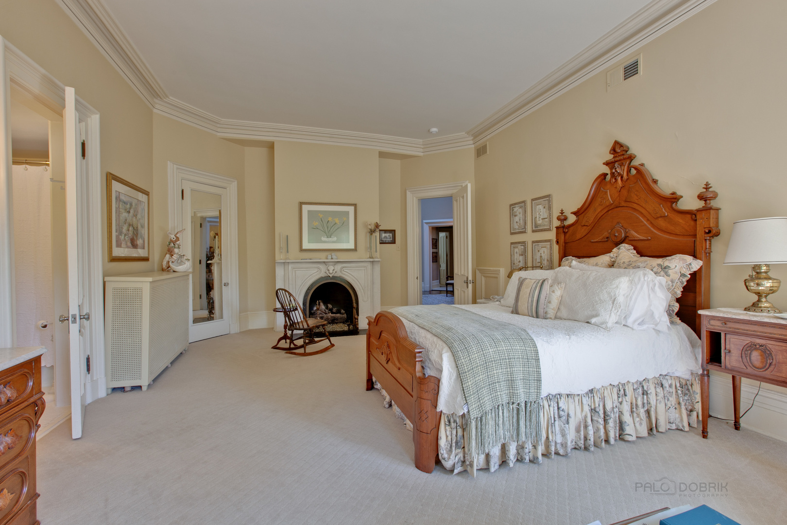 644 East Deerpath Road Lake Forest, IL 60045 - Photo 29 of 48 a bedroom with a bed and a fireplace