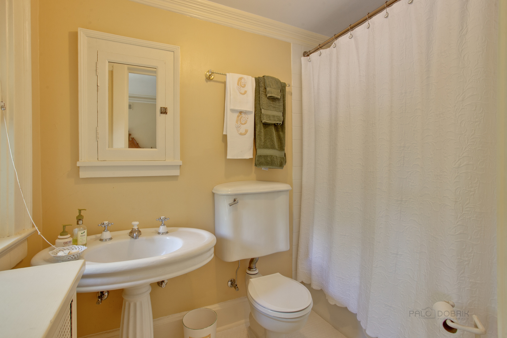 644 East Deerpath Road Lake Forest, IL 60045 - Photo 31 of 48 a bathroom with a sink a toilet and shower curtain