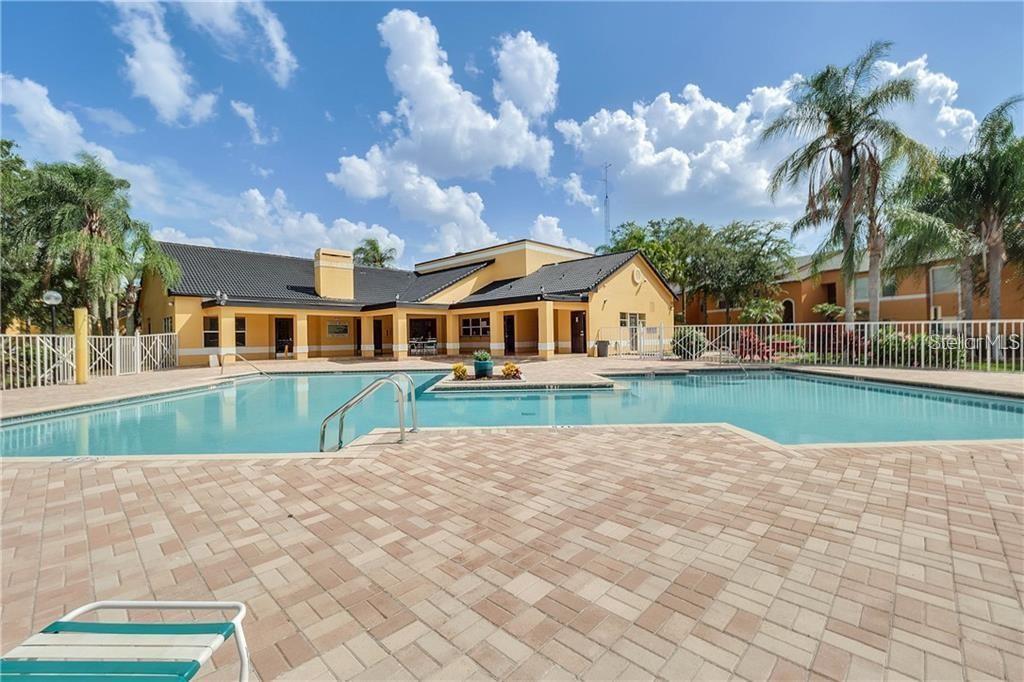 4606 Commander Drive, Unit 1124 Orlando, FL 32822 - Photo 12 of 16 a view of house that has a yard