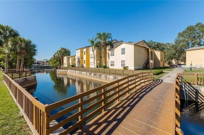 4606 Commander Drive, Unit 1124 Orlando, FL 32822 - Photo 14 of 16 a view of a balcony with chairs