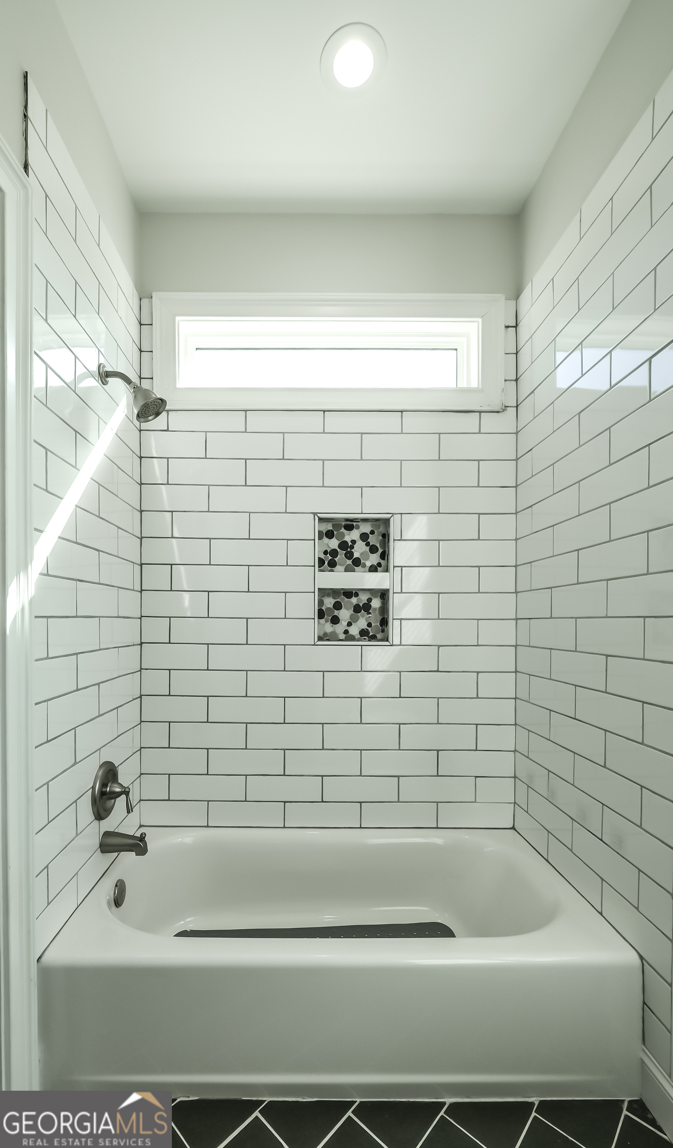 2392 Welcome Road Roopville, GA 30170 - Photo 37 of 43 a bathroom with a bathtub and a shower