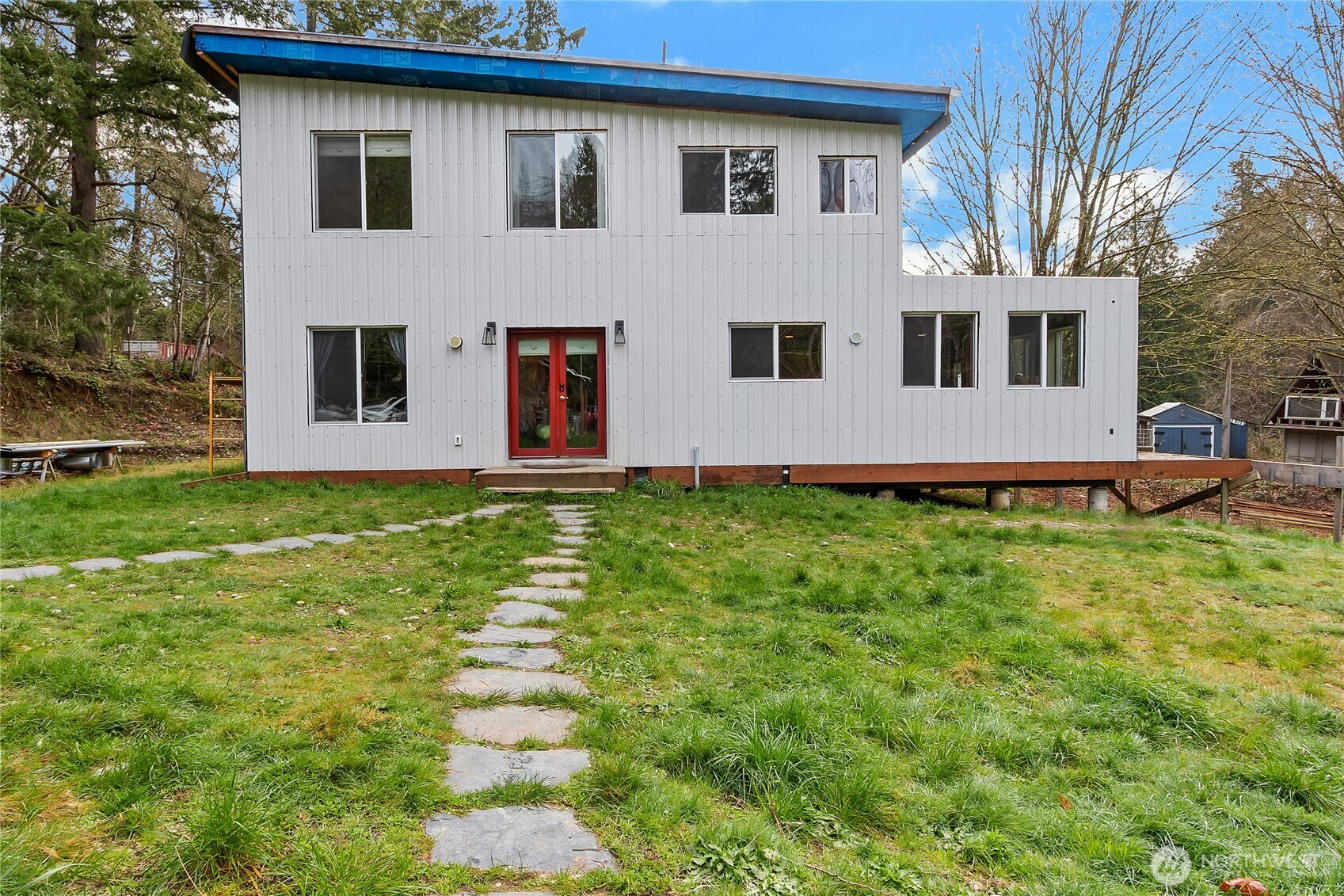 17410 68th Street Northwest Vaughn, WA 98394 - Photo 1 of 24 a front view of house with yard