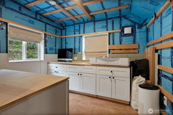 a kitchen with a sink cabinets and window