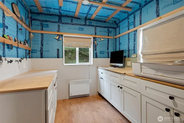 a view of a storage & utility room with two washing machine