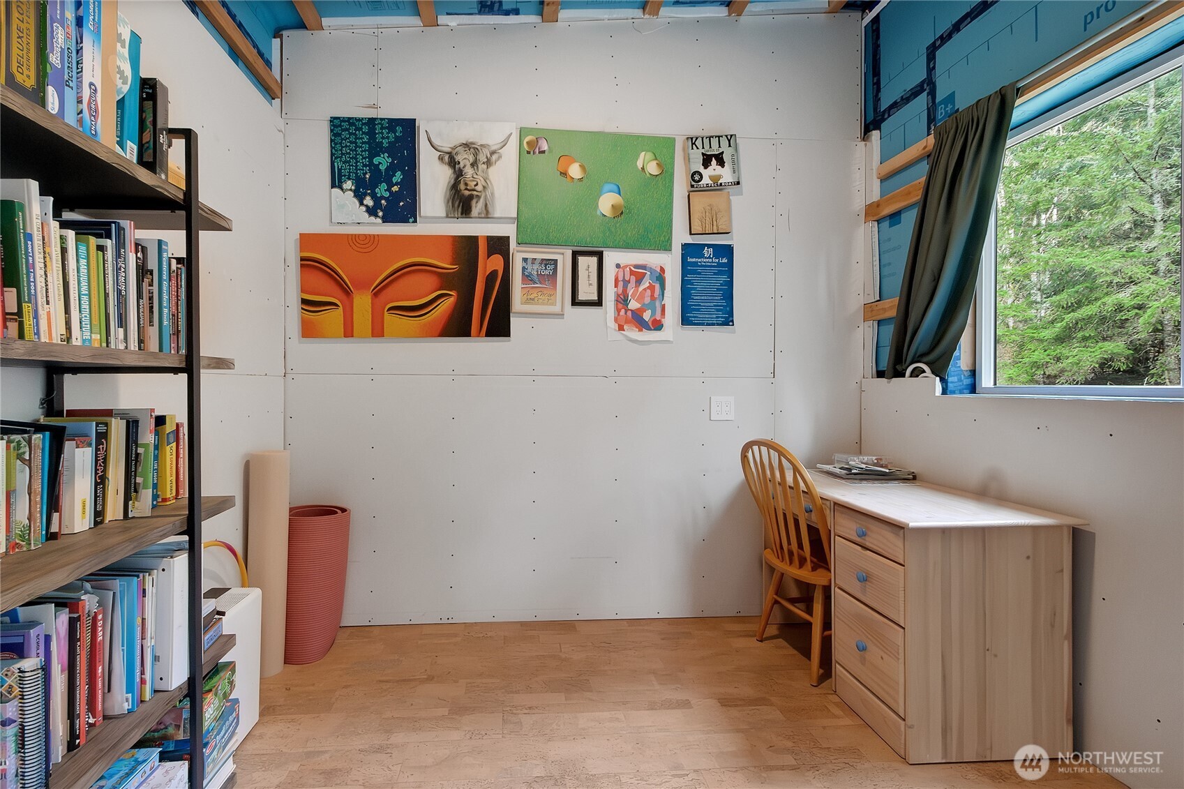 17410 68th Street Northwest Vaughn, WA 98394 - Photo 15 of 24 a room with furniture and a book shelf