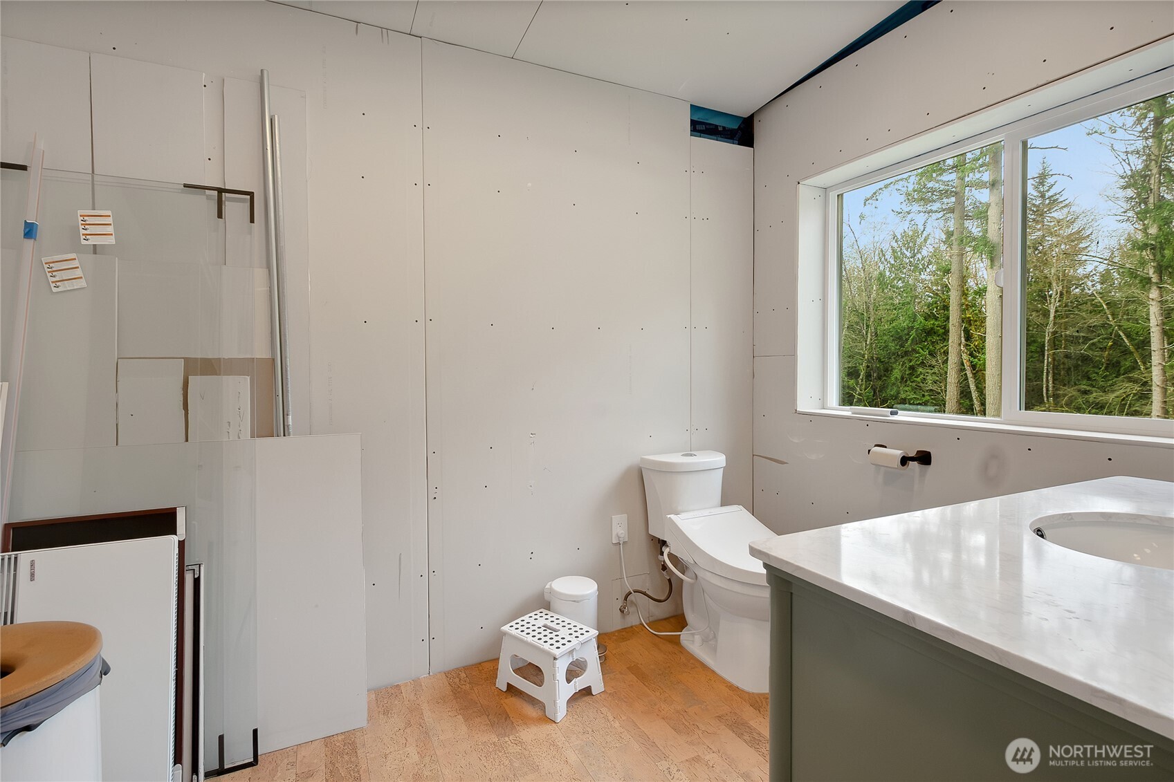 17410 68th Street Northwest Vaughn, WA 98394 - Photo 18 of 24 a bathroom with a sink a toilet and a window