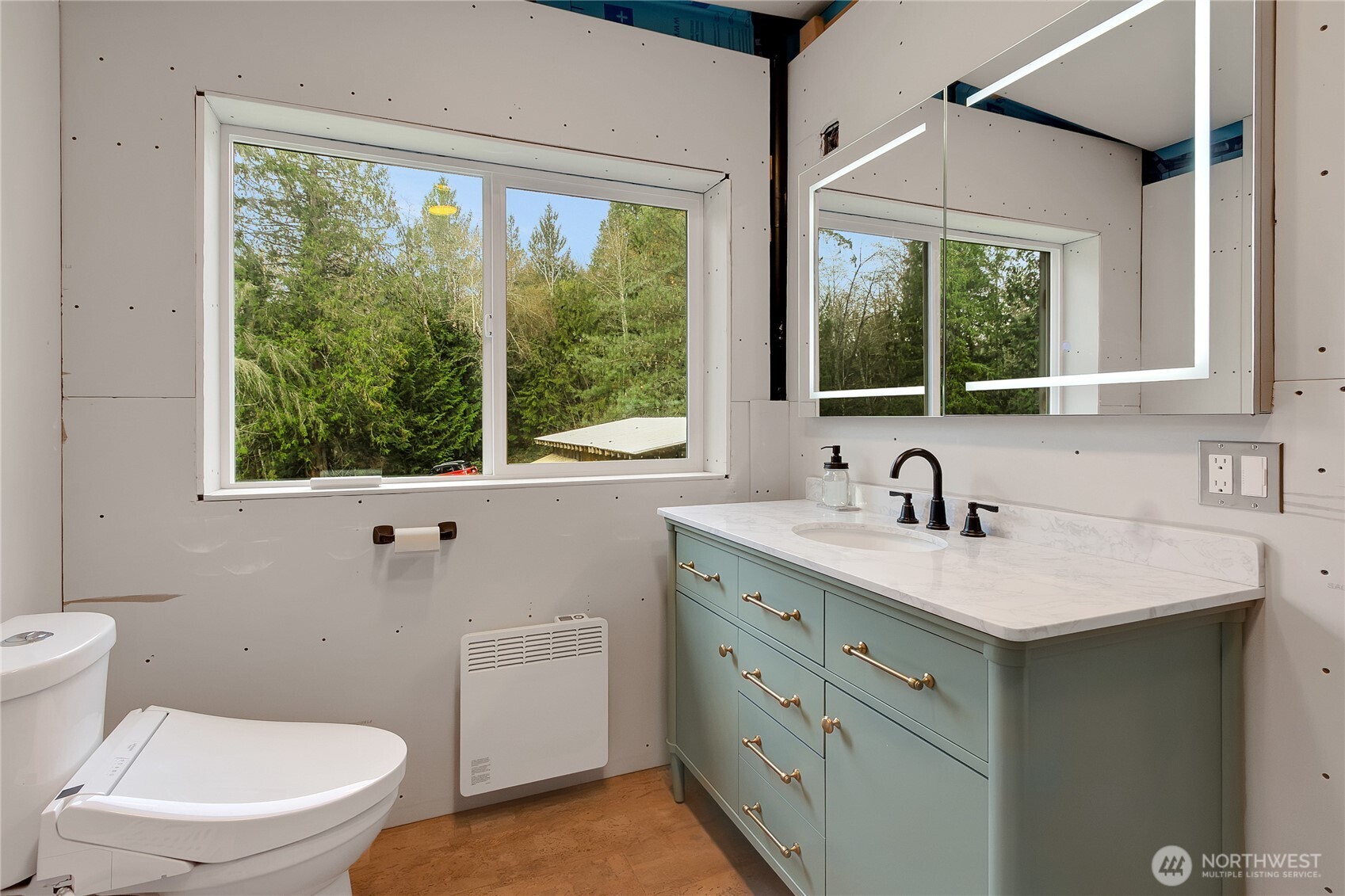 17410 68th Street Northwest Vaughn, WA 98394 - Photo 19 of 24 a bathroom with a granite countertop sink a large mirror and a window