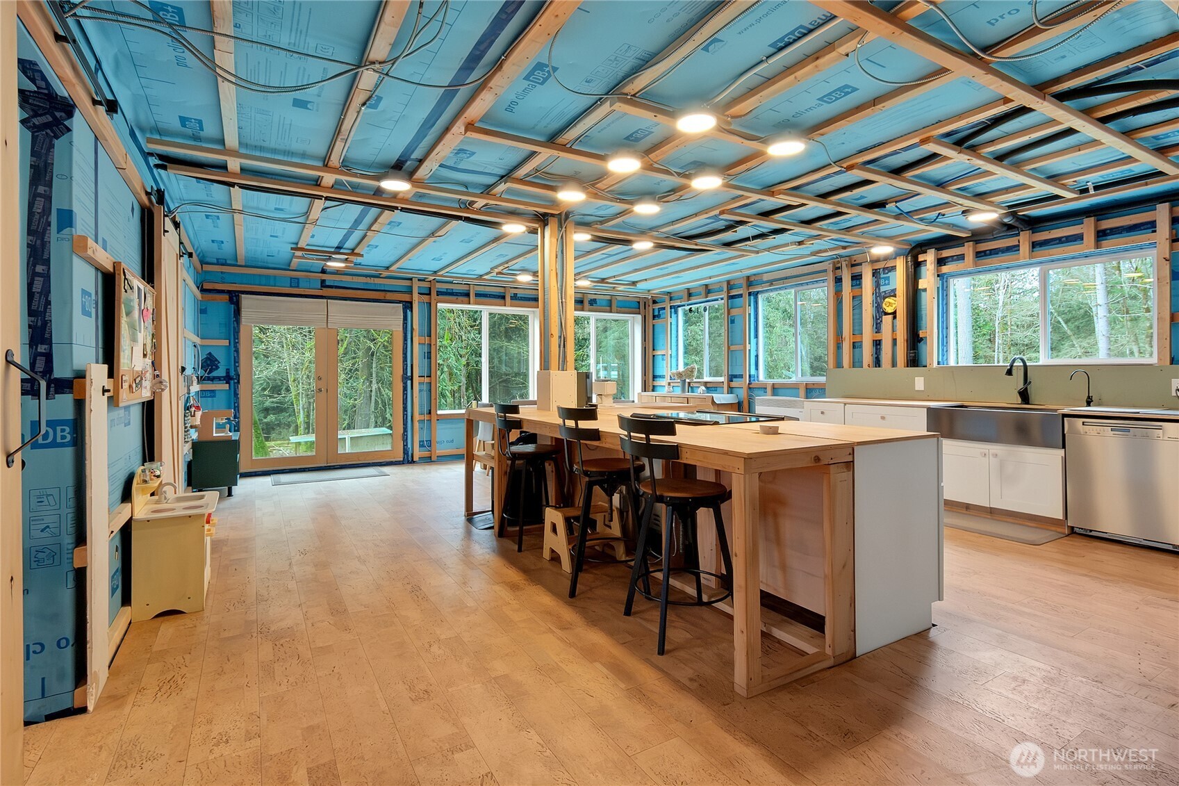 17410 68th Street Northwest Vaughn, WA 98394 - Photo 3 of 24 a view of a dining room with furniture a chandelier and a rug