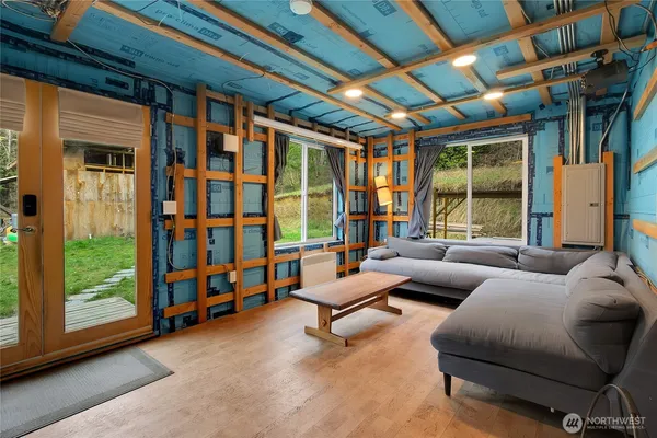 a living room with furniture and a large window