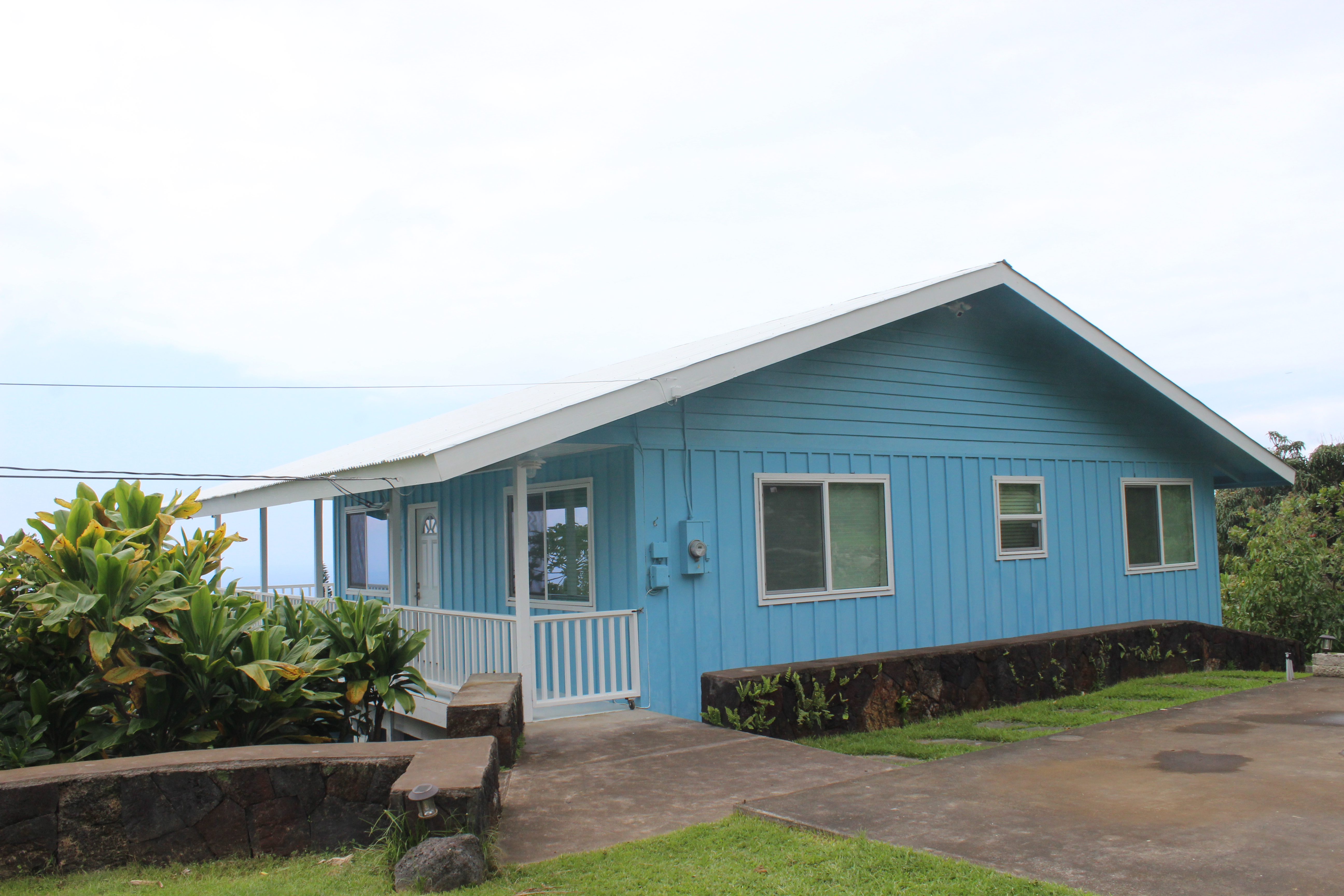 83-5477 Hawaiʻi Belt Road Captain Cook, HI 96704 - Photo 18 of 30 a view of a house with a yard