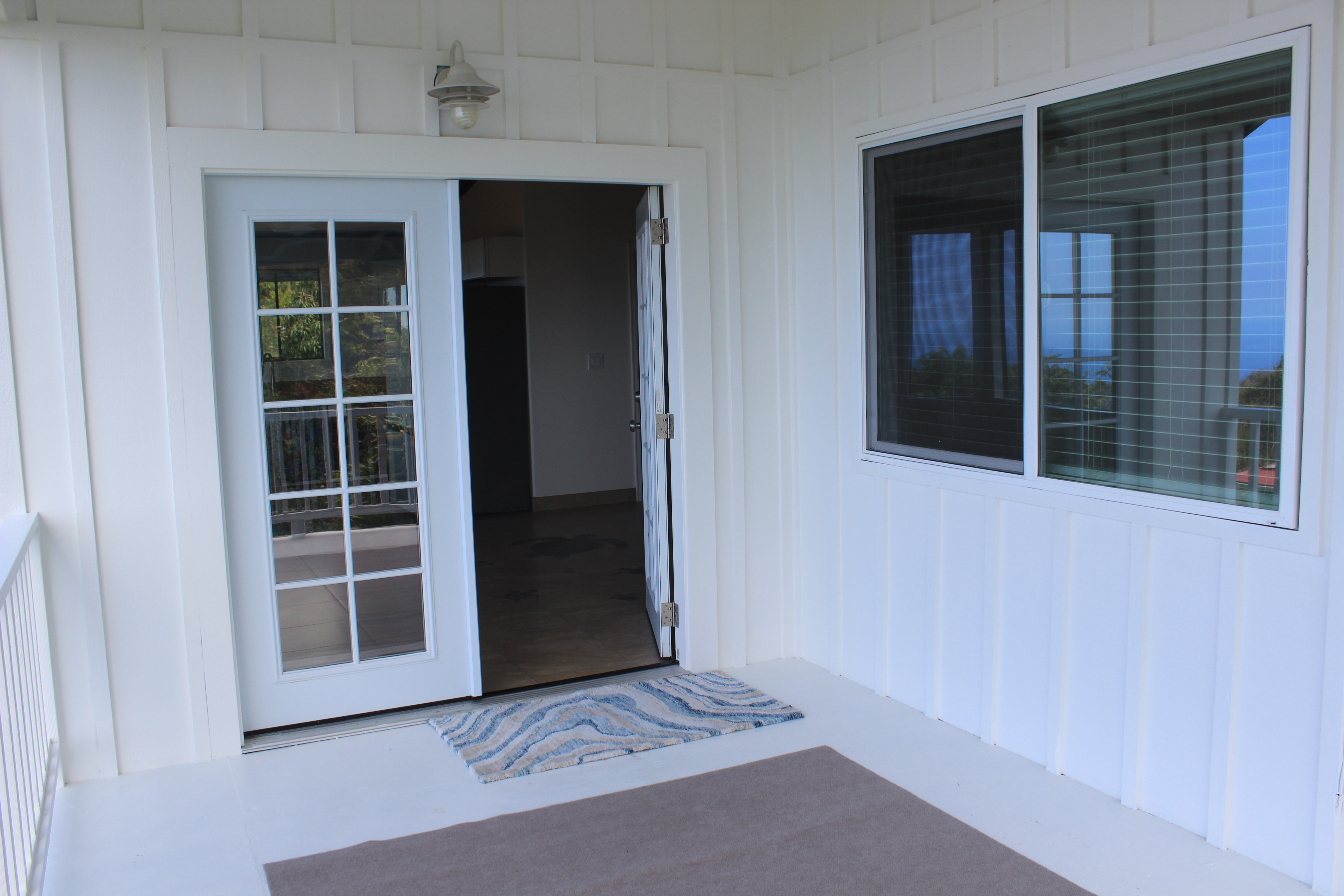 83-5477 Hawaiʻi Belt Road Captain Cook, HI 96704 - Photo 20 of 30 a view of front door of a house