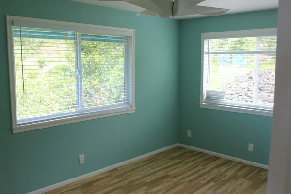 a view of a room with closet and window