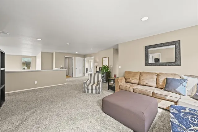 a living room with furniture and a table