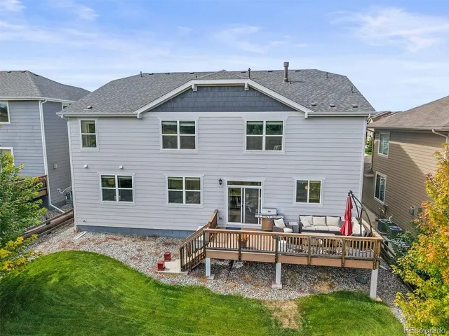 a view of balcony with wooden floor and outdoor seating