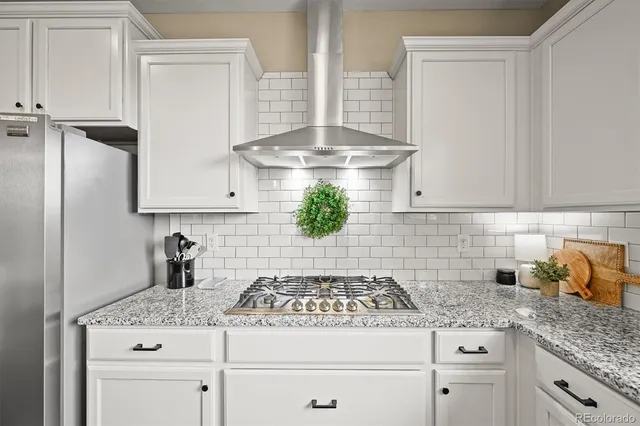 a kitchen with appliances cabinets and a counter top space