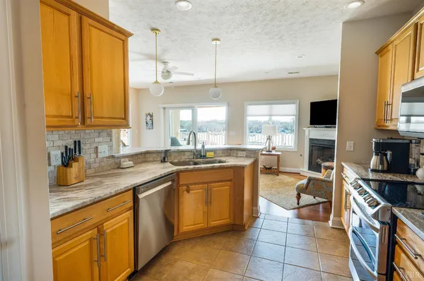 a kitchen with a sink and a window