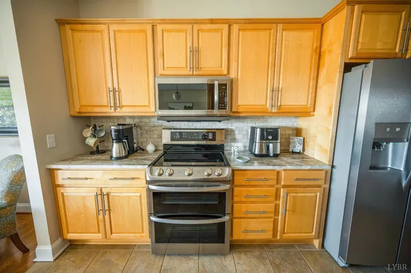 a spacious bedroom with a bed and a potted plant