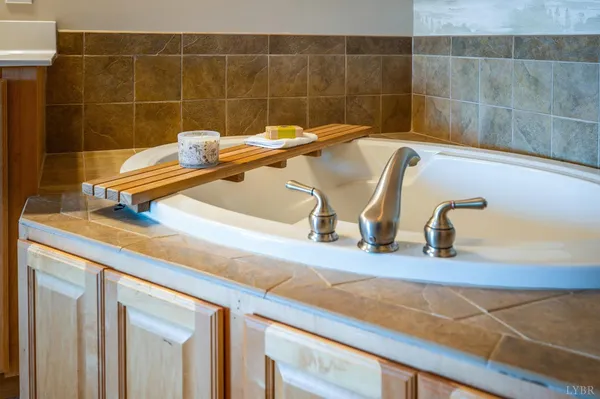 a bathroom with a shower and a sink