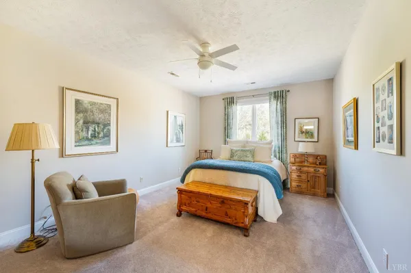 a front view of a house with yard and garage