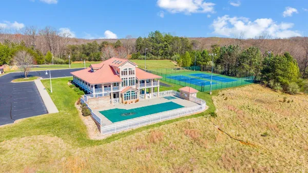 a living room with fireplace furniture and a wooden floor
