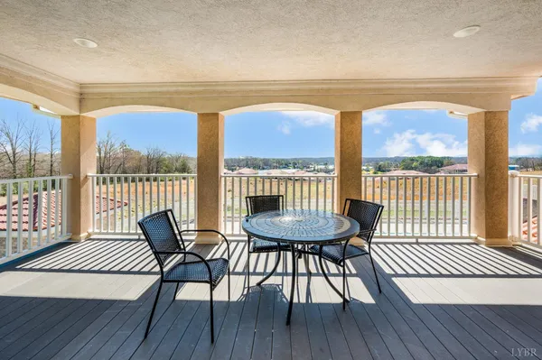 a view of a house with a yard and sitting area