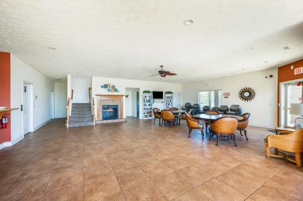a swimming pool with lawn chairs