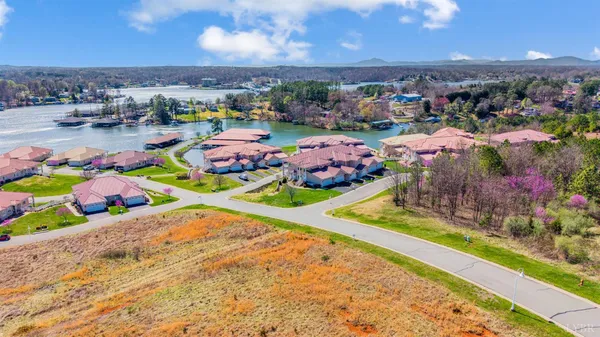 a swimming pool with outdoor seating and yard
