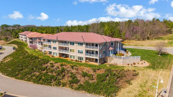 a view of a house with swimming pool and sitting area