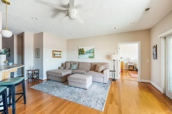 a living room with fireplace furniture and a flat screen tv