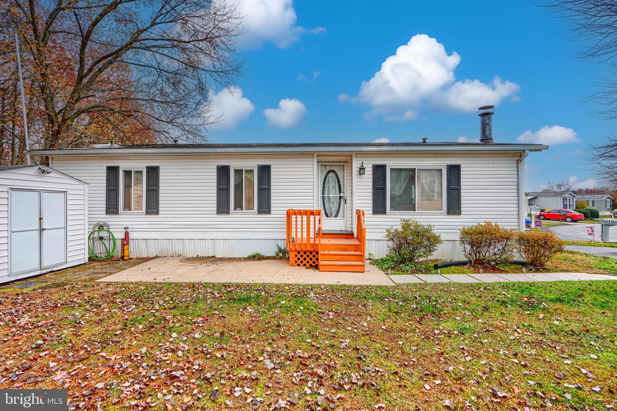 a front view of a house with an outdoor seating