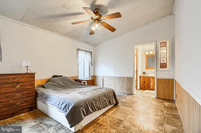 a kitchen with stainless steel appliances a stove a sink and a refrigerator