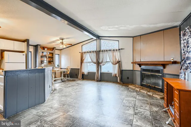 a view of a livingroom with furniture and a fireplace