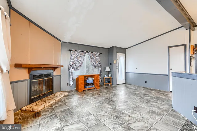 a view of a livingroom with a fireplace and furniture