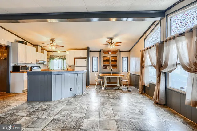 a view of a living room and entry way