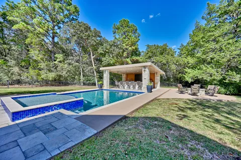 a view of a backyard with chairs