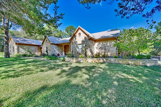 a front view of house with yard and green space