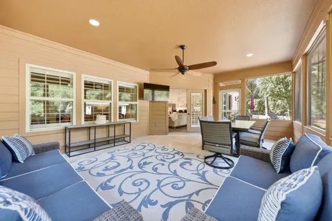 a view of a dining room with furniture window and outside view
