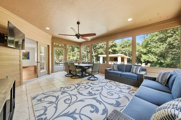 a view of a house with a yard and garage